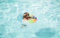 Summer vacation fun. Child swimming and jumping on the waves. Kids having fun at aquapark. Funny kid on inflatable Royalty Free Stock Photo