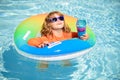 Summer vacation fun. Cocktail on watter pool in the summer. Funny portrait of child. Kid having fun in swimming pool Royalty Free Stock Photo