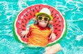 Summer vacation fun. Cute kid in swimming pool. Summer swimming and relax, swim on ring in pool, poolside. Royalty Free Stock Photo