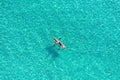 Summer vacation fun, sport activity. Men on Canoe kayak in turquoise blue Aegean Sea, aerial view