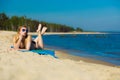 Summer vacation Girl in bikini sunbathing on beach Royalty Free Stock Photo