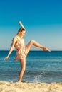 Summer vacation. Girl having fun on the sea coast Royalty Free Stock Photo