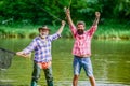 Summer vacation. Happy cheerful people. Fisherman with fishing rod. Activity and hobby. Fishing freshwater lake pond Royalty Free Stock Photo