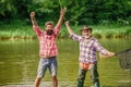 Summer vacation. Happy cheerful people. Fisherman with fishing rod. Activity and hobby. Fishing freshwater lake pond Royalty Free Stock Photo