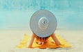 Summer vacation, happy relaxing young woman with straw hat lying on sand on the beach on sea background Royalty Free Stock Photo