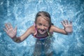 Summer vacation, healthy lifestyle and happy childhood concept. Top view of cute child girl having fun in swimming pool. Kid Royalty Free Stock Photo