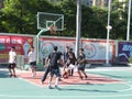 In summer vacation, high school graduates play basketball in the stadium basketball court.