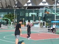 In summer vacation, high school graduates play basketball in the stadium basketball court.