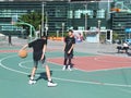 In summer vacation, high school graduates play basketball in the stadium basketball court.