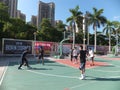 In summer vacation, high school graduates play basketball in the stadium basketball court.