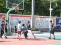 In summer vacation, high school graduates play basketball in the stadium basketball court.