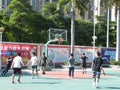 In summer vacation, high school graduates play basketball in the stadium basketball court.
