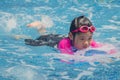 Happiness Asian cute little girl has feeling funny and enjoy in swimming pool.