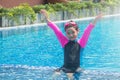 Happiness and smiling Asian cute little girl has feeling funny and enjoy in swimming pool. Royalty Free Stock Photo