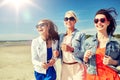 Group of smiling women in sunglasses on beach Royalty Free Stock Photo