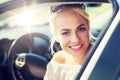 Happy teenage girl or young woman in car Royalty Free Stock Photo