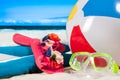 Summer vacation. Mask goggles and color ball on beach background Royalty Free Stock Photo