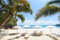 Summer vacation nature travel beautiful summer landscape with chair beach umbrella on sand - Tropical Holiday coconut leaf palm Royalty Free Stock Photo