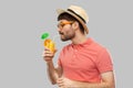 Man in straw hat drinking orange juice cocktail Royalty Free Stock Photo