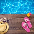 Summer vacation. Pink sandals by swimming pool Royalty Free Stock Photo