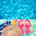 Summer vacation. Pink sandals by swimming pool Royalty Free Stock Photo