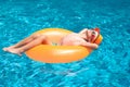 Summer vacation on pool water. Child swim with float ring in swimming pool. Kids summer holidays and vacation concept Royalty Free Stock Photo