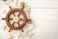 Summer vacation, sailing boat themed holiday house and marine exploration conceptual idea with vintage wooden helm used to Royalty Free Stock Photo