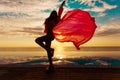 Summer Vacation. Silhouette of beauty dancing woman on sunset near the pool with ocean view. Royalty Free Stock Photo