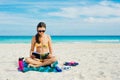 Summer Vacation. Smelling tourist women relaxing and reading book with sunglasses in beach Royalty Free Stock Photo