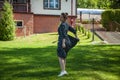 Summer vacation and summertime. Summertime fashion style. Woman in summer dress dancing on the green grass. Romantic girl dance on Royalty Free Stock Photo