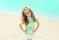 Summer vacation, travel concept - little girl child on beach wearing a sunglasses Royalty Free Stock Photo