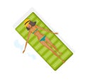 Girl is resting on beach, floating on an inflatable mattress.