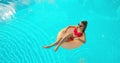 Summer Vacation Woman in bikini on inflatable mattress in swimming pool. Top view of girl relaxing sunbathing enjoying Royalty Free Stock Photo