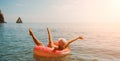 Summer vacation woman in hat floats on an inflatable donut mattress. Happy woman relaxing and enjoying family summer Royalty Free Stock Photo