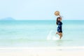 Summer vacations. Lifestyle woman relax and chill on beach background.  Asia happy young people running on the wave sea, summer tr Royalty Free Stock Photo