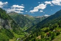 Summer valley with Grossarler Ache small river and blue cloudy sky