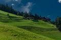 Summer valley with Grossarler Ache small river and blue cloudy sky