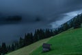 Summer valley morning with fog with Grossarler Ache river and blue cloudy sky