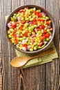 Summer vegetable salad with edamame beans close-up in a bowl. Vertical top view Royalty Free Stock Photo