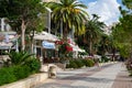 Summer view of alley with palms in Saranda Albania, Promenade walkway by the beach with date palms and restaurants Royalty Free Stock Photo