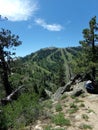 Bogus Basin Ski area from Mores Mountain Loop with woman hiker summer vertical Royalty Free Stock Photo