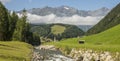 Summer view on the charming Austrian village Umhausen with the rive Ã¶tz in the foreground