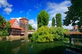 Summer view of the German traditional medieval half-timbered Old Town architecture and bridge over Pegnitz river in Nuremberg, Ger