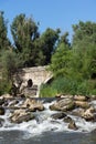 Summer view of Kadin most - a 15th-century stone arch bridge over the Struma River at Nevestino, Bulgaria Royalty Free Stock Photo