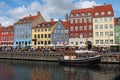 Summer view of Nyhavn pier with color buildings i ships, in the Old Town of Copenhagen