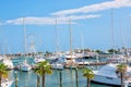 Summer view of pier with ships, yachts and other boats with ferris wheel in Rimini, Italy Royalty Free Stock Photo