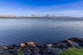 Snow-capped mountains and large boulders frame Saltfjorden near Bodo Royalty Free Stock Photo