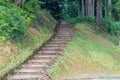 Summer view of wooden steps climbing up into forest, Fukui Prefecture, Japan