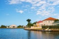 Summer villa of George Town, Cayman Islands. View on summer villa from sea. Summer villa houses on blue sky