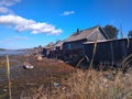 Summer village landscape, Kem, Karelia, Russia. Ebb, lonely boat, blue sky.